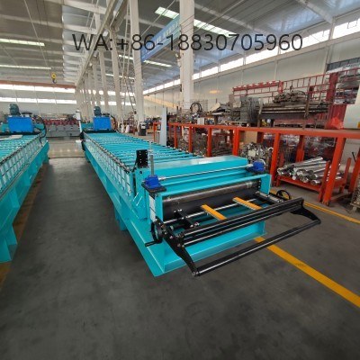 Mesin pembentuk Spandek 935 untuk produksi panel atap baja dengan akurasi tinggi, kecepatan stabil, dan dukungan penuh untuk profil custom.
