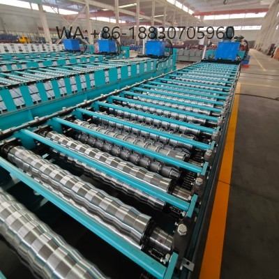Mesin pembentuk Spandek 935 untuk produksi panel atap baja dengan akurasi tinggi, kecepatan stabil, dan dukungan penuh untuk profil custom.
