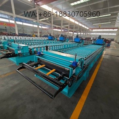 Mesin pembentuk Spandek 935 untuk produksi panel atap baja dengan akurasi tinggi, kecepatan stabil, dan dukungan penuh untuk profil custom.