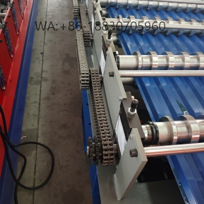 Pabrikan mesin cetak spandek tipe 935 otomatis berkecepatan tinggi. Solusi investasi terbaik untuk produksi atap galvalum gelombang bulat yang presisi dan bebas cacat.